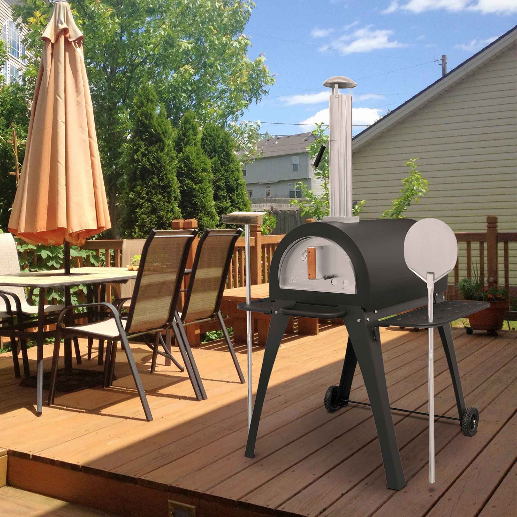 Dellonda DG103 Outdoor Pizza Ovens Action shot - in garden - 2nd perspective