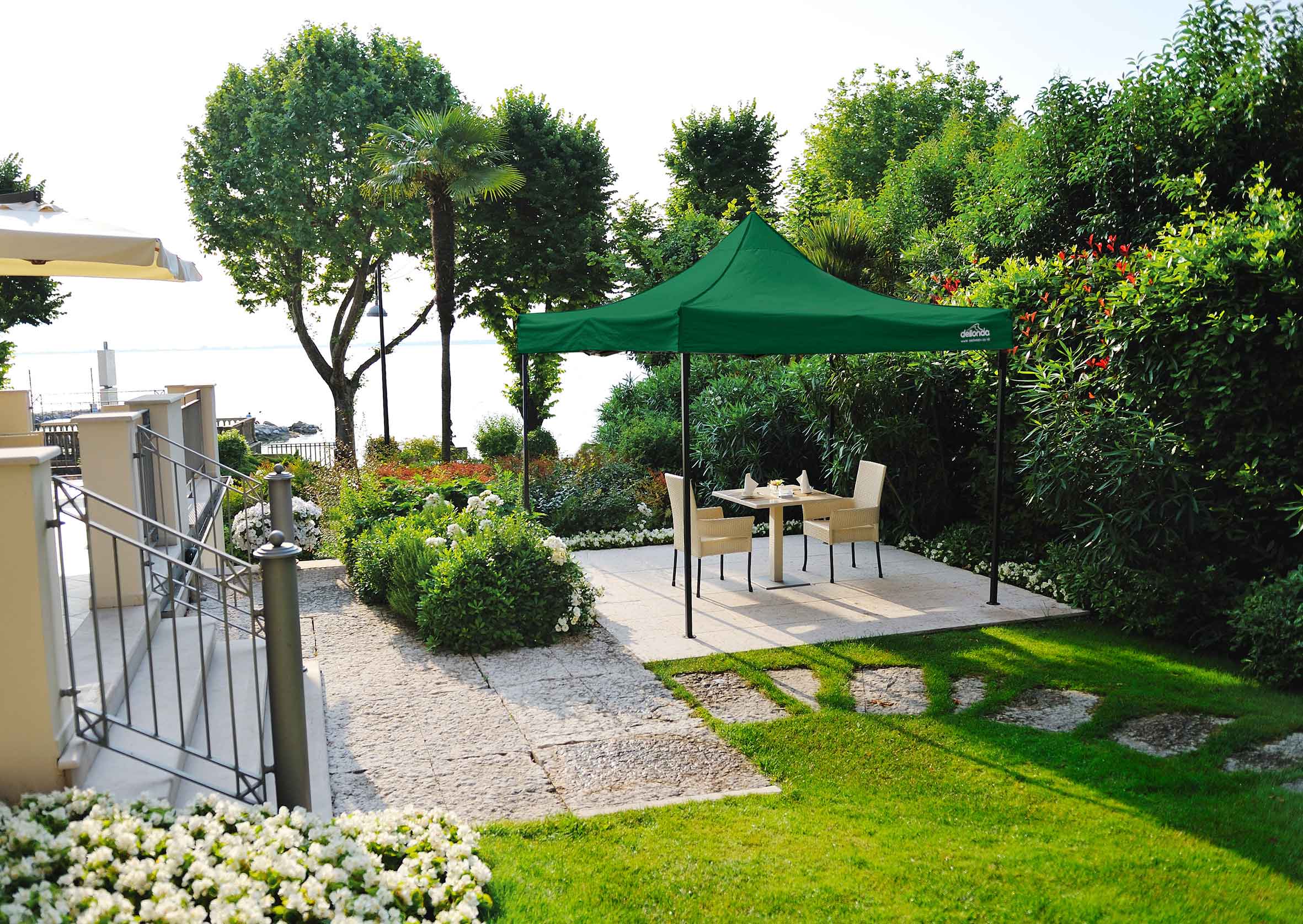 Dellonda DG128 Gazebos Action shot - in garden - 2nd perspective