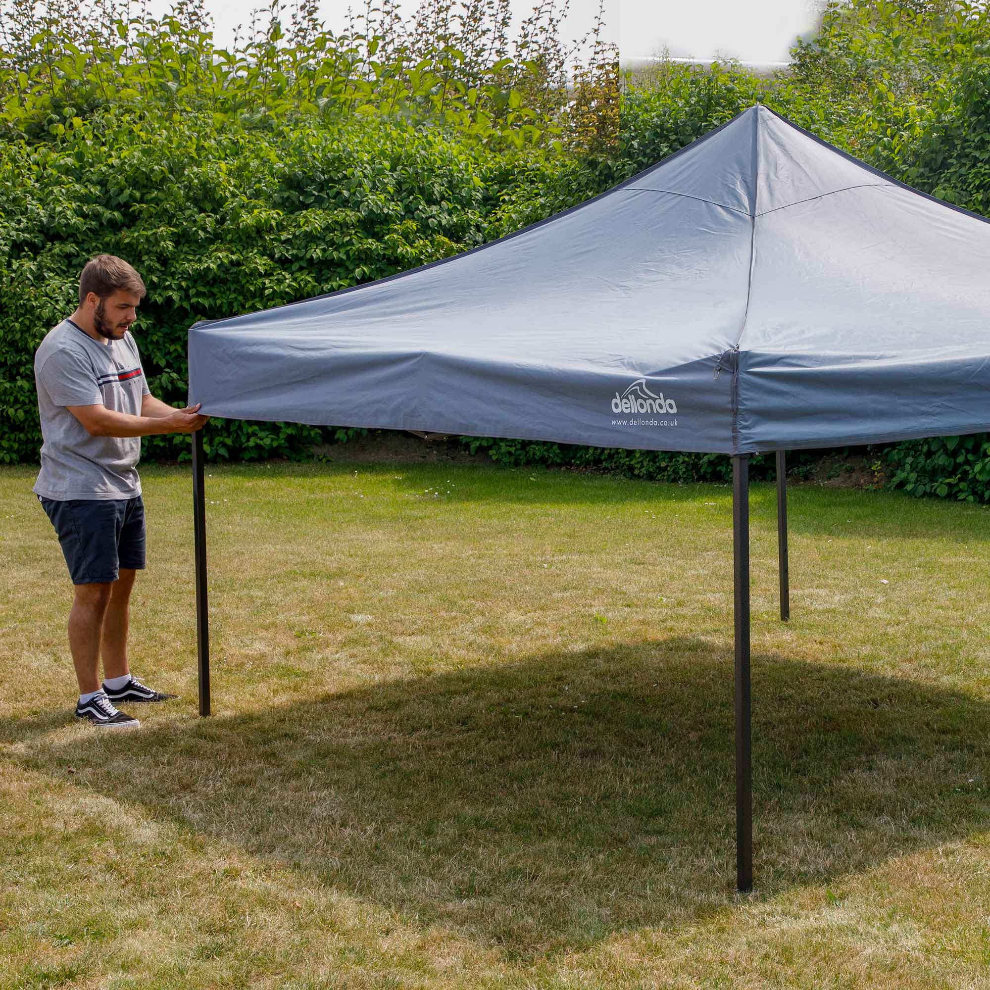 Dellonda DG129 Gazebos Action shot - extended - with cover - on