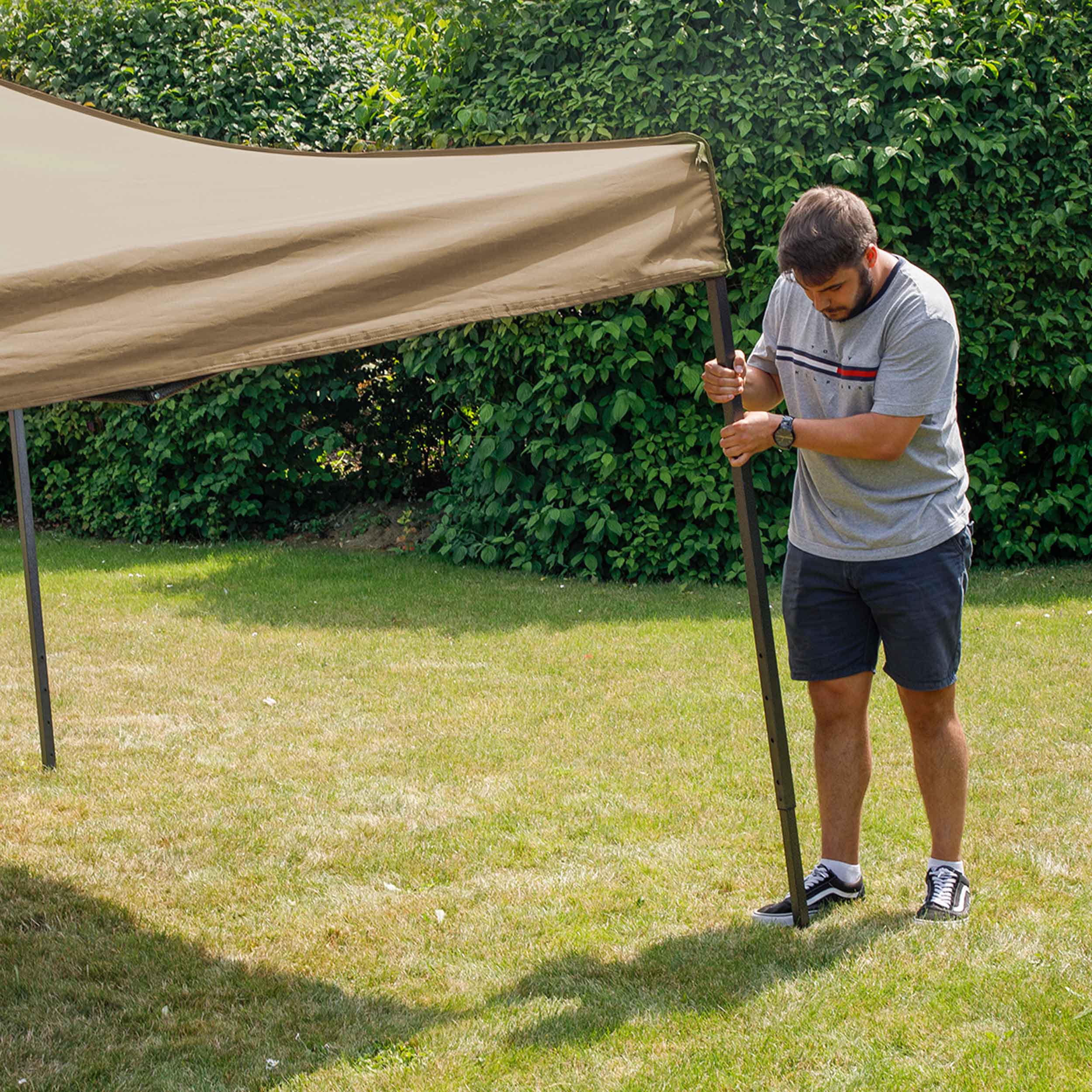 Dellonda DG130 Gazebos Action shot - extending - leg