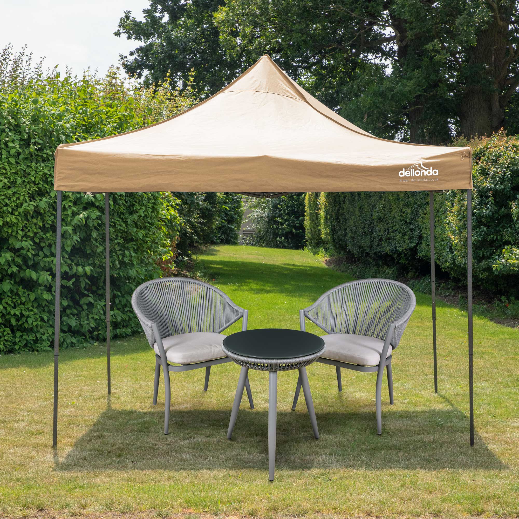 Dellonda DG130 Gazebos Action shot - in garden - with chairs