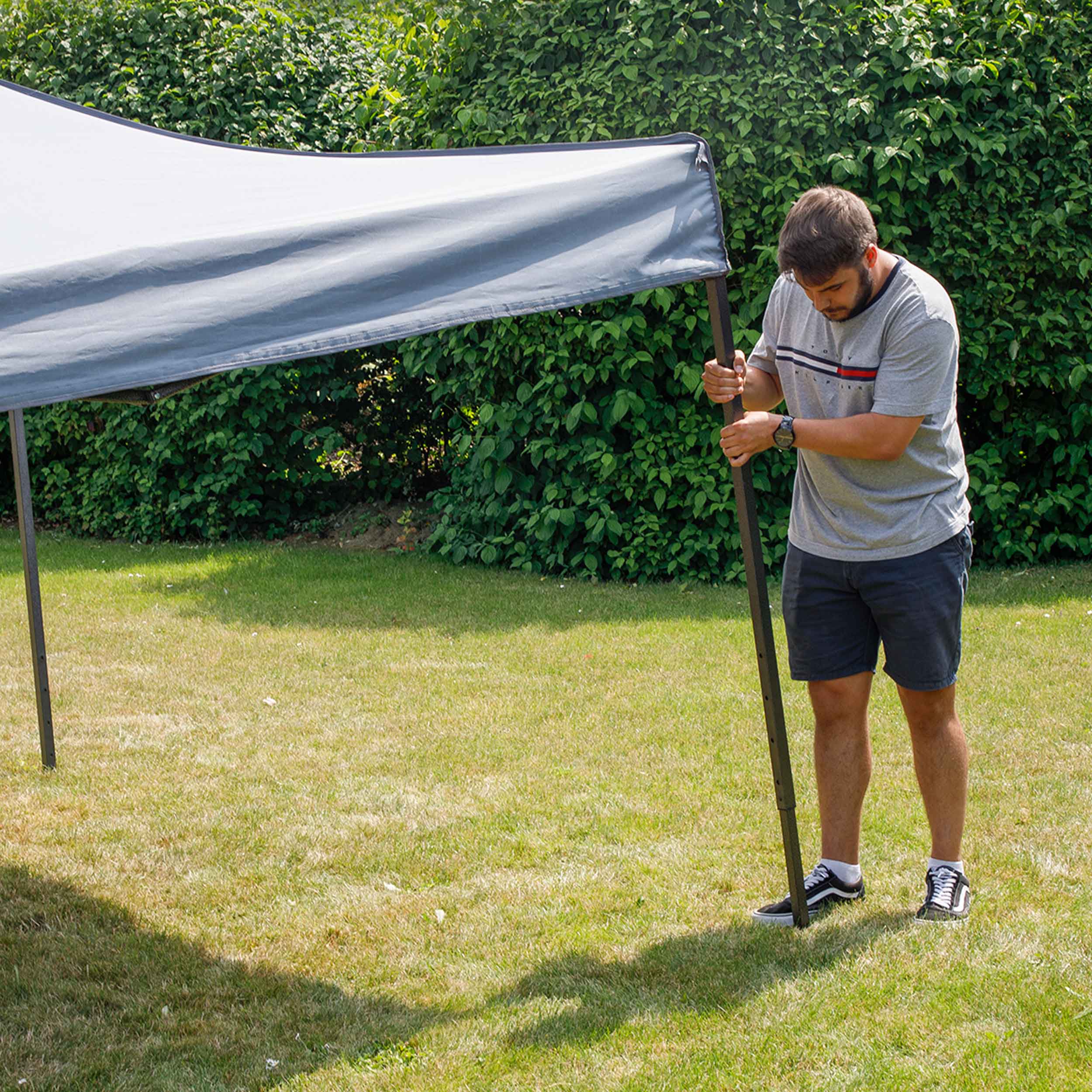 Dellonda DG133 Gazebos Action shot - extending - leg