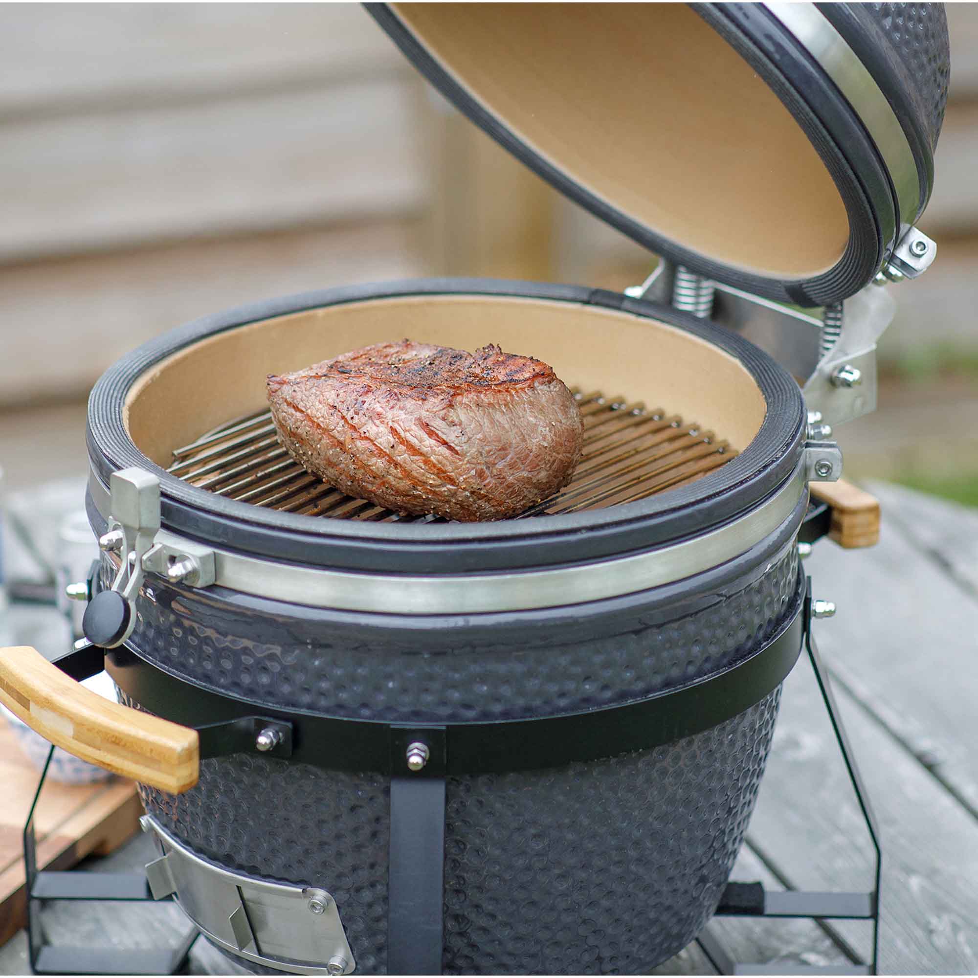 Dellonda DG158 Kamado Grills Action shot - cooking - beef