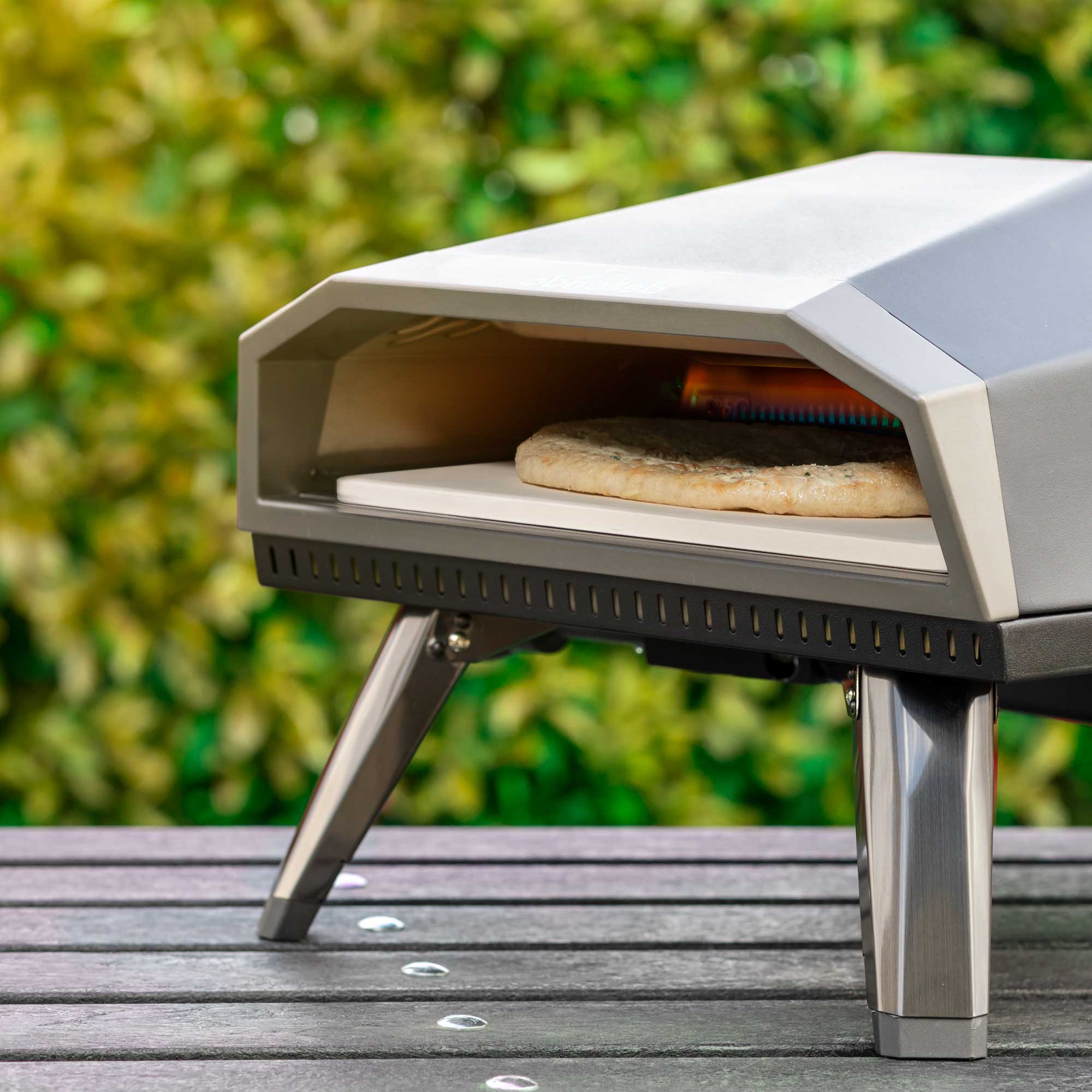Dellonda DG257 Gas Pizza Ovens Action shot - lifestyle - 2nd perspective