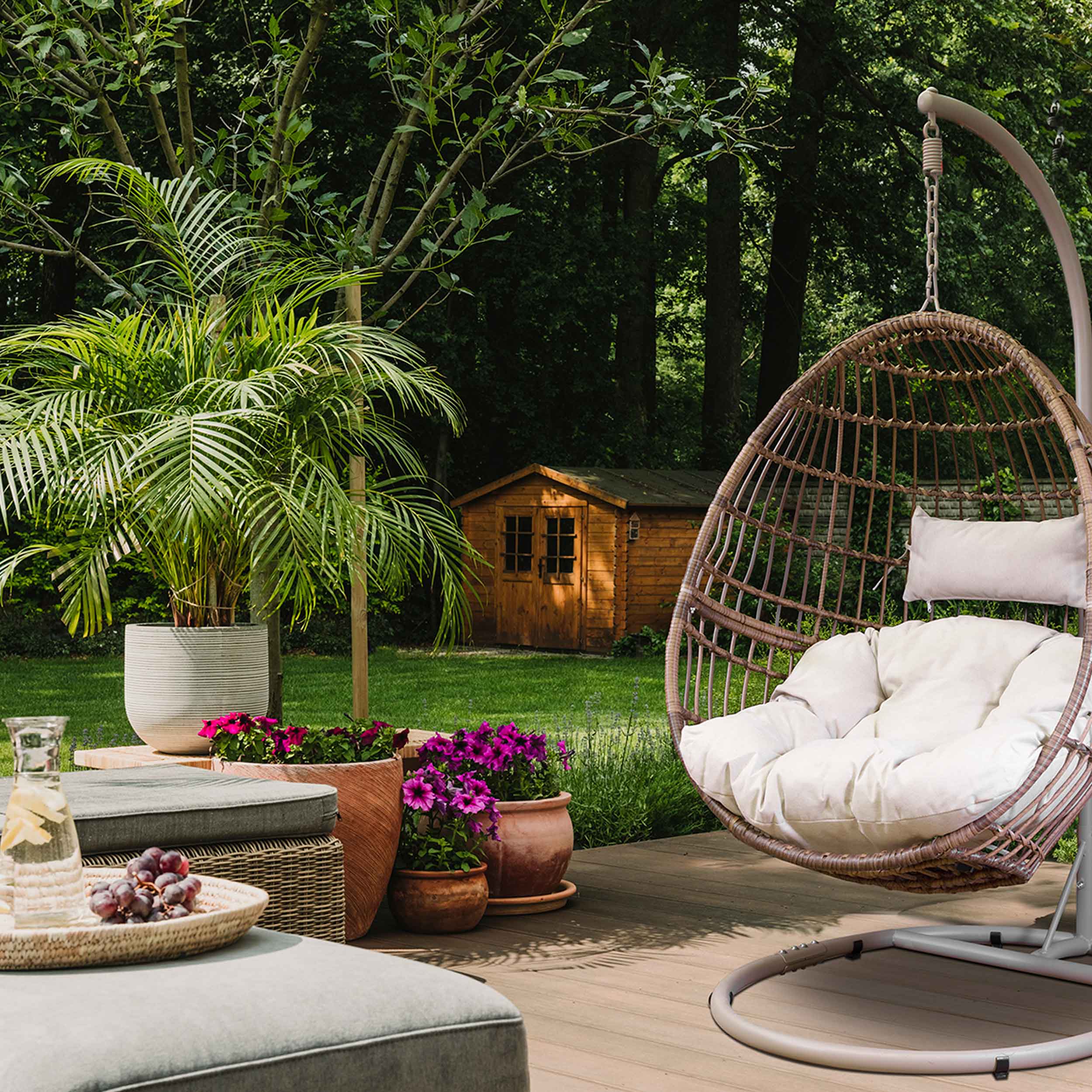 Dellonda DG60 Hanging Chairs Action shot - in garden