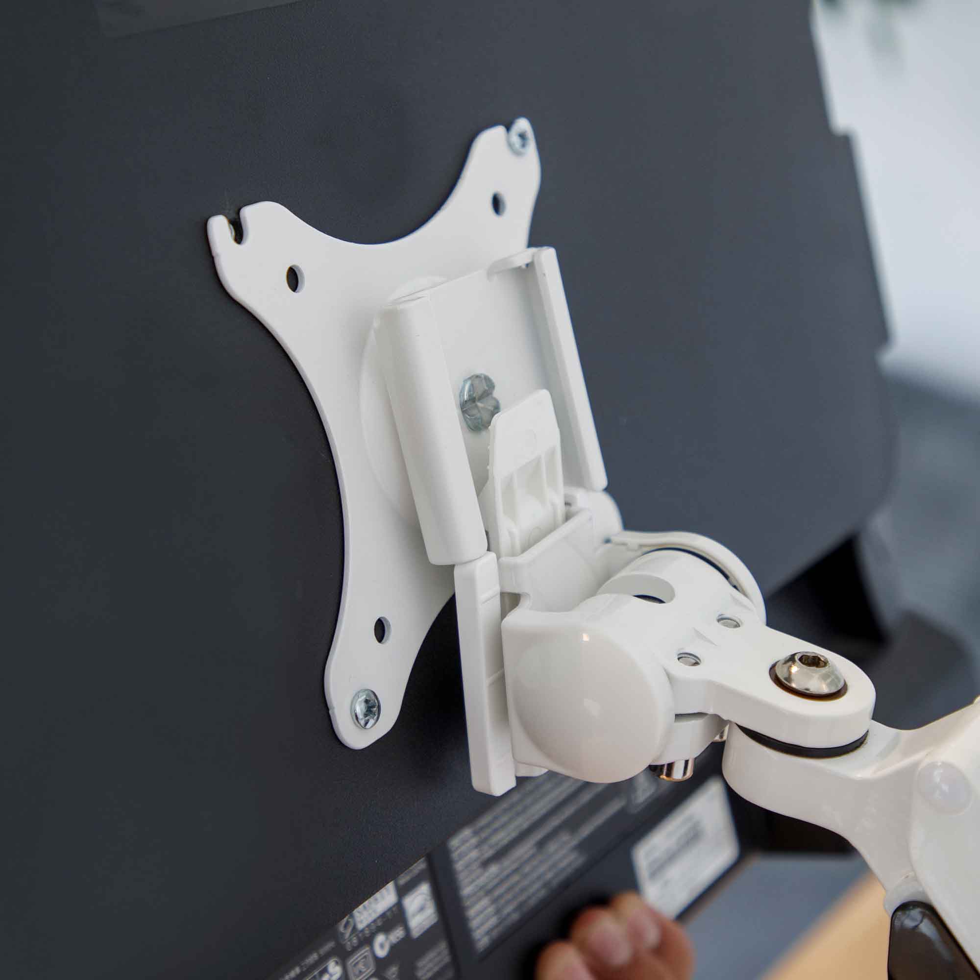 Dellonda DH26 Monitor Arms Action shot - attaching to monitor - arm