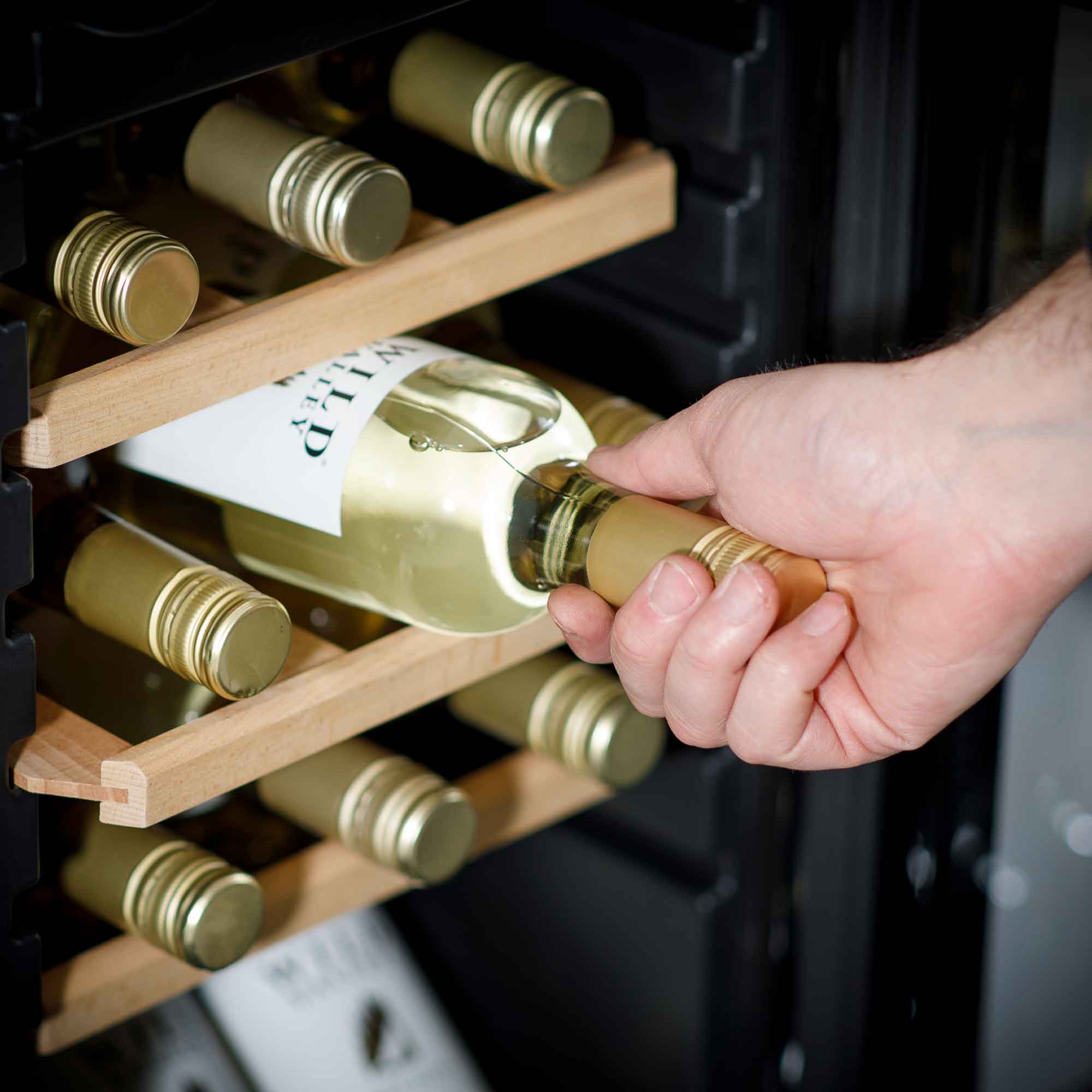 Baridi DH89 Wine Fridges Action shot - pulling - bottle - out