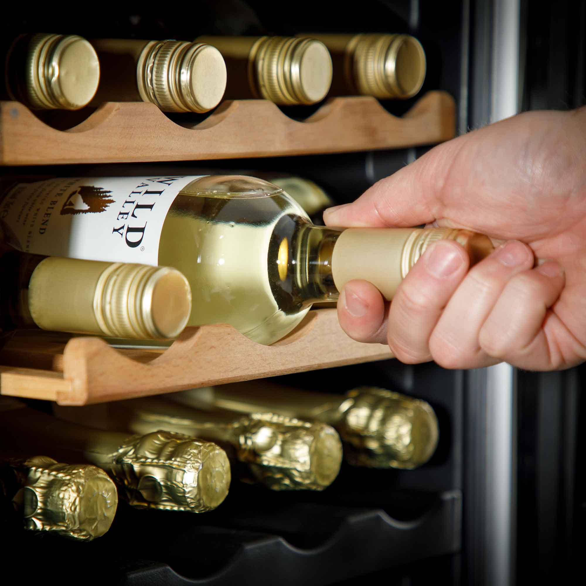 Baridi DH91 Wine Fridges Action shot - pulling - bottle - out